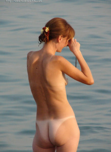 Nudists beach crowded with young bodies